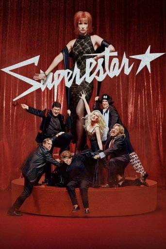 The poster features a glamorous woman in a black outfit standing atop a red platform, surrounded by other performers in black suits. The background is filled with red curtains, creating a dramatic and theatrical atmosphere. The word "Superstar" is prominently displayed in white, with stars flanki...