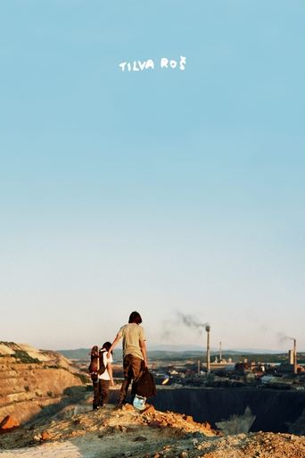 The poster features a serene outdoor scene with two figures standing on a rocky outcrop against a vast, clear blue sky. The warm tones of the earth and the soft lighting evoke a sense of peace and tranquility, while the distant smokestacks hint at industrial activity in the background. The minima...