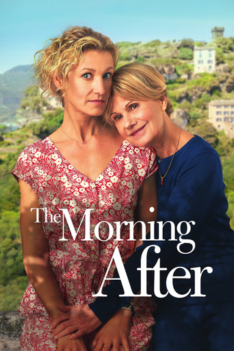 The poster features two women in a sunlit, picturesque setting with lush greenery and a white building in the background. The woman on the left wears a floral dress, while the woman on the right is dressed in a blue top. The mood is warm and inviting, suggesting a romantic and family-oriented sto...