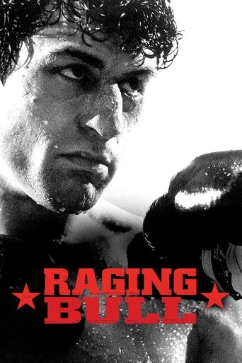This movie poster features a gritty, intense close-up of boxer Rocky Balboa with a fierce expression, emphasizing the raw emotion and physicality of the sport. The bold red and white color scheme, combined with the starbursts, conveys a sense of raw energy and passion.
