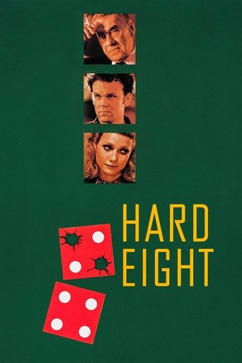 The poster features three close-up portraits of actors against a dark green background, with the title "HARD EIGHT" in bold yellow letters. Red dice with white dots are scattered below, suggesting a game or challenge. The overall mood is mysterious and intriguing, hinting at a thriller or drama.