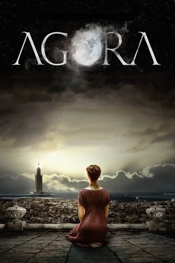 The poster features a lone woman in a red dress sitting on a stone pier, gazing at a distant lighthouse against a moonlit sky. The dark, moody atmosphere with swirling clouds and the moon creates a mysterious and serene mood.