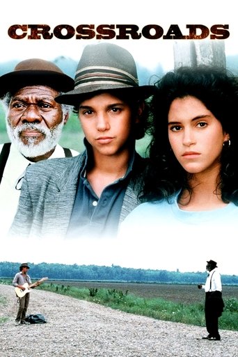 The poster features three characters against a backdrop of a rural landscape, with warm earth tones and muted colors evoking a somber mood. The title "Crossroads" is prominently displayed at the top, hinting at the film's themes of choice and uncertainty.
