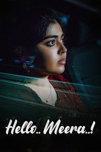 The poster features a young woman with dark hair and dramatic makeup, gazing intently into the distance. The scene is dimly lit with cool blue tones, creating a mysterious and atmospheric mood. The title "Hello.. Meera..!" is prominently displayed in white text at the bottom, suggesting a persona...