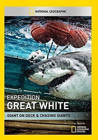 The poster features a dramatic underwater scene with a giant white shark dominating the frame, its powerful jaws open in a moment of intense action. The vibrant red and blue hues of the ocean create a vivid backdrop that emphasizes the shark's menacing presence. The National Geographic branding a...