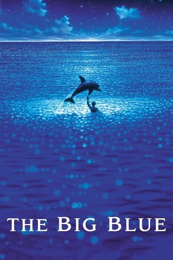 The poster features a serene night scene with dolphins leaping through the water, illuminated by a glowing blue light that reflects off the surface. The deep blue hues evoke a sense of calm and wonder, while the title "The Big Blue" anchors the image with a mysterious and captivating atmosphere.