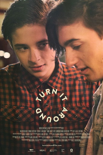 The poster features two young men in a red plaid shirt, their faces close and intimate, suggesting a deep emotional connection. The warm lighting and soft focus create a nostalgic, romantic atmosphere. The title "TURN IT AWAY" is elegantly displayed in a circular font, hinting at a story about ch...