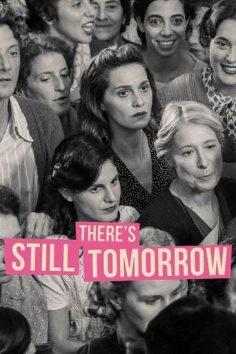 This black-and-white poster features a group of women in a crowded, intimate setting, exuding a sense of camaraderie and shared experience. The muted tones and close-up shots create a nostalgic and emotional atmosphere, hinting at themes of friendship and resilience. The bold pink text "THERE'S S...