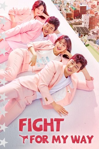 The poster features five people in matching pink outfits lying on a white surface, with a cityscape in the background. The mood is cheerful and energetic, suggesting a fun and adventurous theme. The bold red text "FIGHT FOR MY WAY" adds a strong message to the image.