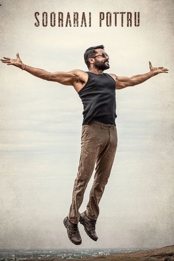 A muscular man in a black tank top and brown pants leaps joyfully against a serene, overcast sky. The warm tones of his outfit contrast with the muted, grayish background, evoking a sense of freedom and happiness.