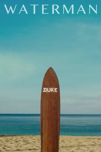 The poster features a wooden surfboard labeled "DUKE" standing on a sandy beach under a serene blue sky. The muted colors evoke a calm, reflective mood, suggesting themes of solitude and introspection.