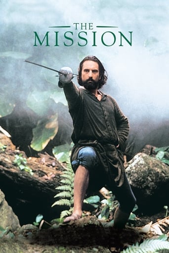 The poster features a rugged man in period attire, holding a sword aloft against a misty, ancient forest backdrop. The muted greens and browns evoke a sense of mystery and adventure, while the film's title, "The Mission," hints at an epic quest.