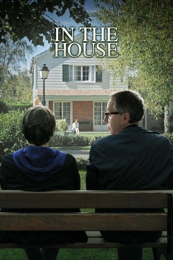 The poster features two people sitting on a wooden bench, facing away from the camera, gazing at a charming suburban house bathed in soft, golden sunlight. The warm tones of the house and the serene atmosphere evoke a sense of peaceful contemplation and nostalgia.