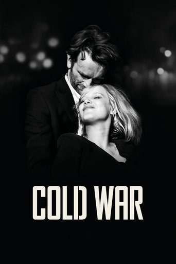 The poster features a dramatic black-and-white image of a man and woman in an intimate embrace, with the title "COLD WAR" prominently displayed at the bottom. The dark tones and moody lighting evoke a sense of tension and romance, capturing the essence of the film's themes.
