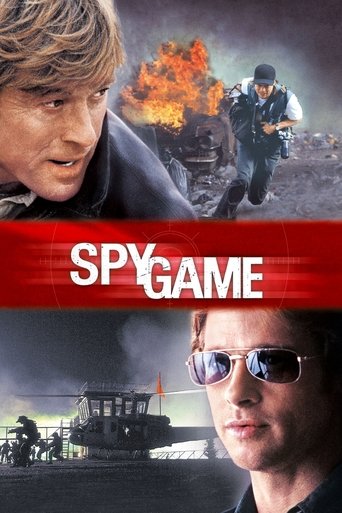 The poster features two men in the foreground, one with a serious expression and the other with sunglasses, set against a backdrop of intense action and fire. The red banner with "SPY GAME" in bold white letters dominates the center, creating a dramatic and suspenseful atmosphere. The overall moo...
