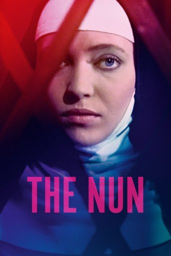 The poster features a woman in a nun's habit against a dramatic red and blue background. The mood is mysterious and intense, with her piercing gaze conveying deep emotion. The title "THE NUN" is prominently displayed in bold pink letters.