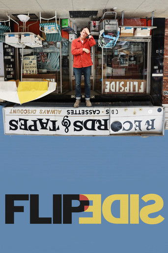 The poster features a man in a red jacket standing proudly in front of a shop, with "Flipside" prominently displayed on a banner. The vibrant red and yellow colors create a bold, energetic mood, while the clean design suggests a fun and straightforward approach to the movie.