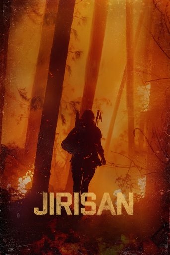 The poster depicts a lone figure walking through a fiery forest, bathed in intense orange and red hues. The silhouette of the character is silhouetted against the glowing backdrop, evoking a sense of danger and urgency. The title "JIRISAN" is prominently displayed at the bottom in bold, golden le...