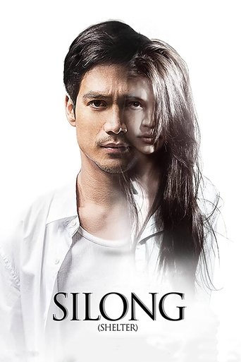 The poster features a man with long, flowing hair against a stark white background, exuding mystery and allure. The title "Silong" is prominently displayed in bold, black letters, with the subtitle "GHOST" beneath it. The overall mood is eerie and suspenseful, hinting at a supernatural thriller.