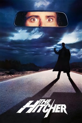 The poster features a silhouette of a man walking down a dark road, with a reflection of his face in a rearview mirror above. The sky is filled with ominous clouds, creating a suspenseful and eerie atmosphere. The title "The Hitcher" is prominently displayed at the bottom, suggesting a thriller o...