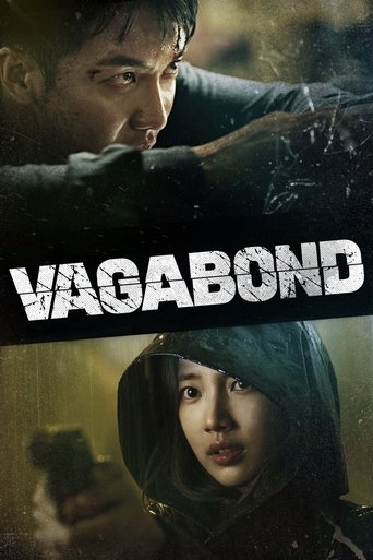 The poster features a gritty, moody scene with two characters in a tense, action-oriented atmosphere. The dark, shadowy background and intense expressions convey a sense of danger and suspense. The title "VAGABOND" is prominently displayed in bold, distressed typography, emphasizing the film's gr...