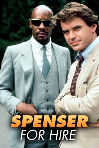 The poster features two men in formal suits against a green background, exuding sophistication and confidence. The man on the left wears sunglasses, while the man on the right sports a confident smile. The title "Spenser: For Hire" is prominently displayed in bold orange letters at the bottom. Th...