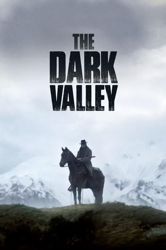 The poster features a lone figure on horseback riding across a grassy hill, silhouetted against a dramatic sky. Snow-capped mountains loom in the background, creating a sense of isolation and mystery. The bold, black text "THE DARK VALLEY" dominates the top, evoking a noir atmosphere.