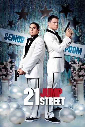 The poster features two men in white suits with black ties, one holding a gun and the other a smartphone, standing against a backdrop of stars and balloons. The vibrant colors and dramatic lighting create an exciting and adventurous mood, hinting at the action-packed storyline of the movie.