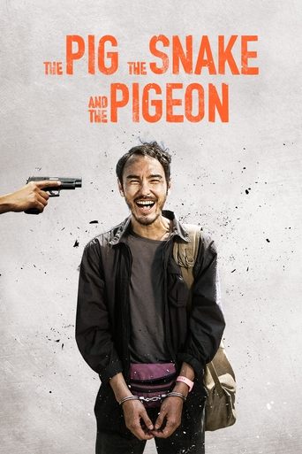The poster features a man in a dark jacket smiling as a gun is pointed at him from the left. The background is a textured gray with splatters, and the title "The Pig, the Snake and the Pigeon" appears in bold orange letters. The overall mood is humorous and slightly comedic.