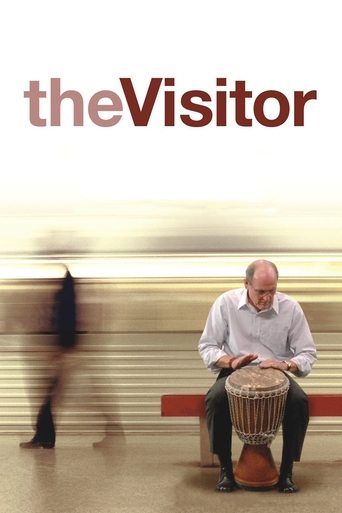 The poster features a man playing a drum in the foreground, while a blurred figure walks past in the background. Warm tones and motion blur create a dynamic, slightly nostalgic atmosphere.