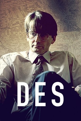 The poster features a man in a suit and tie against a muted, sepia-toned background, evoking a sense of mystery and intrigue. The word "DES" is prominently displayed in bold, white letters, suggesting a title or theme related to the show. The overall mood is somber and contemplative, hinting at a...