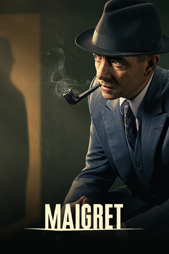 The poster features a moody, shadowy figure in a dark suit and fedora, smoking a pipe against a dimly lit background. The muted tones and dramatic lighting evoke a sense of mystery and intrigue, hinting at the classic noir detective drama of "Maigret."