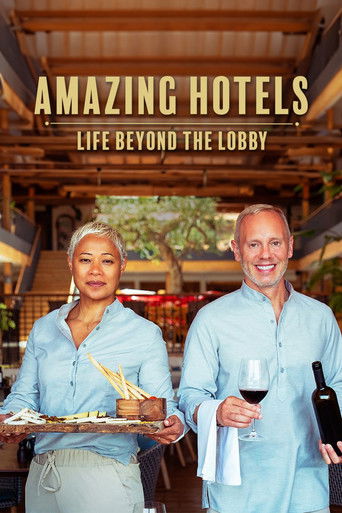 The poster features two smiling hotel staff members in light blue shirts, holding drinks and a tray, exuding a warm, inviting atmosphere. The background suggests an outdoor setting with wooden beams and greenery, enhancing the relaxed, upscale vibe of the show.