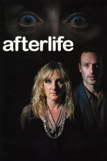 The poster features a dramatic, dark mood with a woman in the foreground wearing a pearl necklace, while a man stands beside her. Above them, a hauntingly close-up view of a woman's eyes adds an eerie atmosphere. The title "Afterlife" is prominently displayed in white text against the shadowy bac...