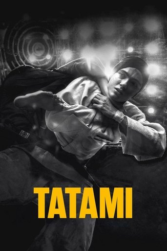 The poster features a dramatic, monochromatic image of two individuals engaged in what appears to be a martial arts or wrestling match. The lighting creates a moody atmosphere, with shadows and highlights emphasizing the tension between the characters. The bold, yellow text "TATAMI" anchors the c...