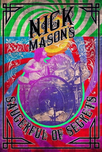The poster features a vibrant, psychedelic scene with a drummer in a purple circle, surrounded by swirling green and pink hues. The title "Nick Mason's Saucerful of Secrets" is prominently displayed in bold, stylized lettering. The overall mood is energetic and theatrical, capturing the essence o...