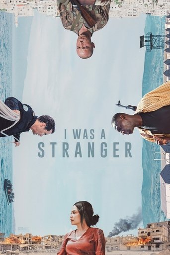 The poster features a surreal composition with people upside down against a pale blue background, evoking a dreamlike atmosphere. The title "I WAS A STRANGER" is prominently displayed in bold, white letters, suggesting themes of isolation and identity. The muted earth tones and fragmented imagery...
