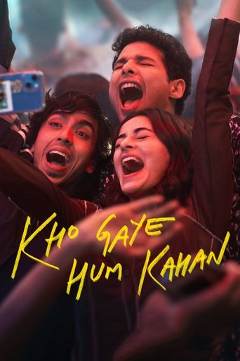 The poster features three energetic young people celebrating with raised arms and open mouths, exuding joy and excitement. The vibrant yellow text "Kho Gaye Hum Kahan" stands out against the dark background, emphasizing the movie's title. The overall mood is one of lively enthusiasm and shared ha...