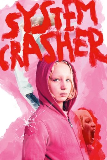The poster features a young girl in a pink hoodie against a vibrant pink background, with the title "SYSTEM CRASHER" in bold red letters. The mood is mysterious and slightly unsettling, evoking themes of digital manipulation and societal collapse.