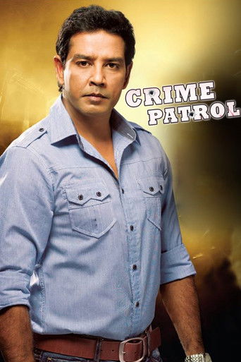 The poster features a serious-looking man in a light blue shirt against a warm, golden background. The title "CRIME PATROL" is prominently displayed in bold, white letters. The overall mood is intense and dramatic, suggesting a serious crime drama.
