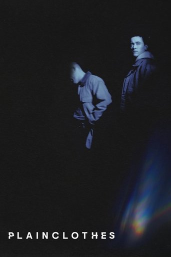 The poster features two figures in shadowy tones, with one leaning forward and the other standing apart. The cool blue and black color palette creates a mysterious and somber mood, suggesting themes of mystery and intrigue.