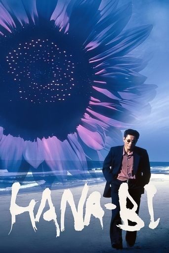 The poster features a man standing on a beach with a large, vibrant sunflower in the background. The colors are vivid, with purples and blues dominating the scene. The mood is mysterious and dreamlike, suggesting a blend of nature and urban life. The title "Hana-Bi!" is prominently displayed in b...