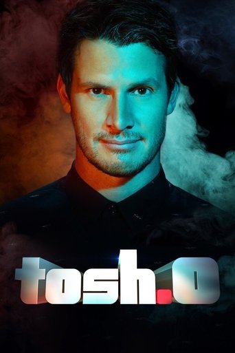 The poster features a man with a serious expression against a dramatic background of warm orange and cool blue tones. The title "Tosh.0" is prominently displayed in bold, metallic lettering at the bottom. The overall mood is intense and mysterious, suggesting a high-stakes drama or thriller.