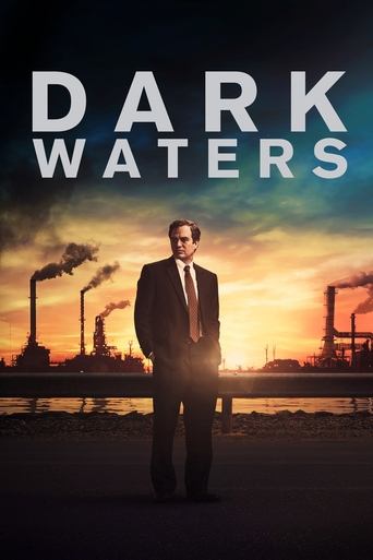 The poster features a man in a suit standing against a dramatic sunset backdrop, with industrial smokestacks emitting plumes of smoke. The title "DARK WATERS" is prominently displayed in bold, white letters at the top. The overall mood is mysterious and ominous, suggesting themes of corporate pow...