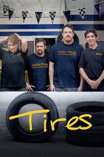 The poster features four men in matching dark blue "Tires" t-shirts, standing confidently behind a large tire. A banner of black and white flags hangs above, adding a sporty vibe. The title "Tires" is prominently displayed in bold yellow letters at the bottom, emphasizing the show's theme. The ov...