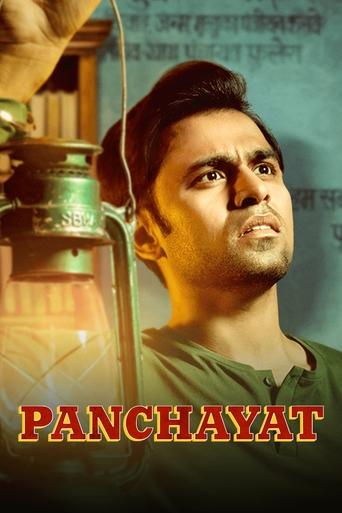 The poster features a man with a serious expression against a warm, golden background. A vintage lantern glows softly in the foreground, adding an old-world charm. The title "PANCHAYAT" is prominently displayed in bold, red letters at the bottom. The overall mood is nostalgic and reflective, sugg...