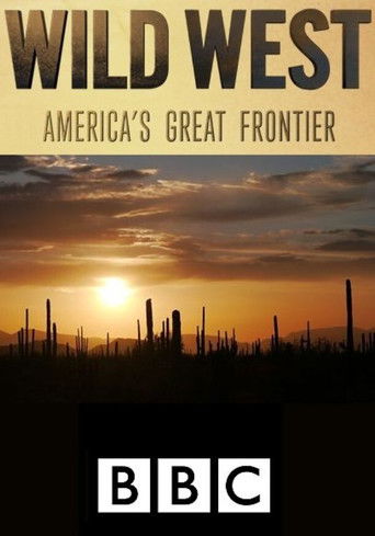 The poster features a dramatic sunset with silhouetted cacti against a vibrant orange sky, evoking a rugged frontier atmosphere. The bold "WILD WEST" title and "AMERICA'S GREAT FRONTIER" subtitle set the theme, while the BBC logo anchors the production.