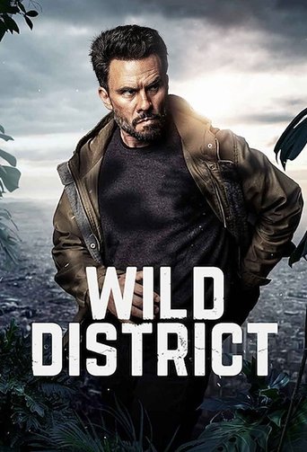 A rugged man in a leather jacket stands defiant against a stormy sky, with the bold title "WILD DISTRICT" prominently displayed. The dark, moody atmosphere and gritty imagery evoke a sense of danger and survival.
