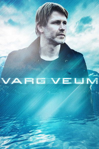 The poster features a man with a contemplative expression against a dramatic blue sky, evoking a sense of mystery and introspection. The title "VARG VEUM" is prominently displayed in bold, white letters, suggesting a story about a man who is both a hero and a tragic figure. The overall compositio...