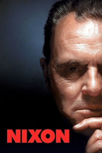 The poster features a close-up of a man's face, his expression intense and serious. The red text "NIXON" stands out against the dark background, emphasizing the film's title. The mood is dramatic and mysterious, hinting at a complex narrative involving political intrigue.